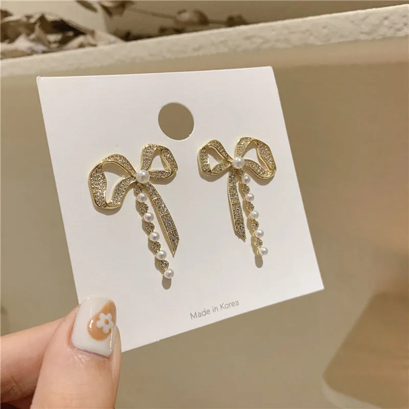 

Bowknot Stud Earrings Imitate Pearl Rhinestone Ear Decoration Party Jewelry Cold Wind Alloy Crystal Material Sweet Temperament