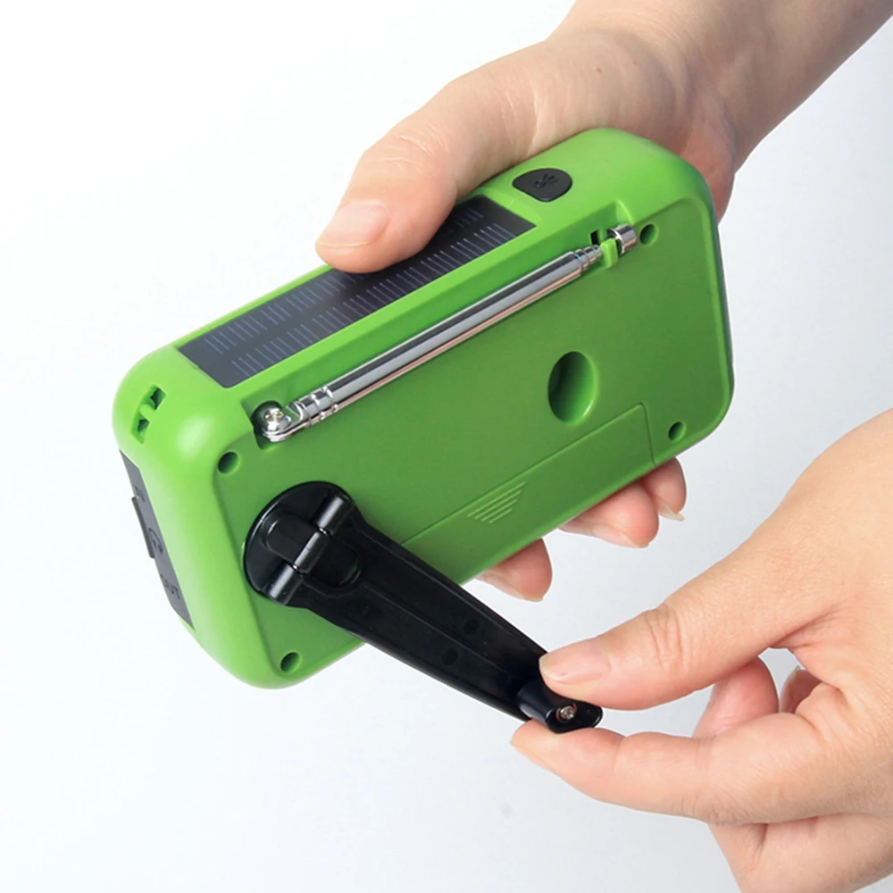 Портативный радиоприемник FM / AM/WB с ручным управлением работает от солнечной