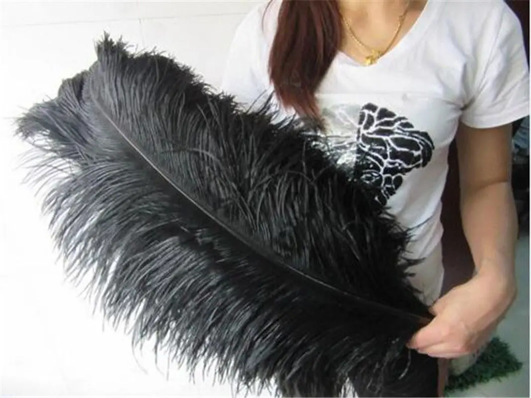 Огромное перо хср. Страусиные перья 75 см. Большие перья для декора. Перья страуса черные. Украшения из страусиных перьев.