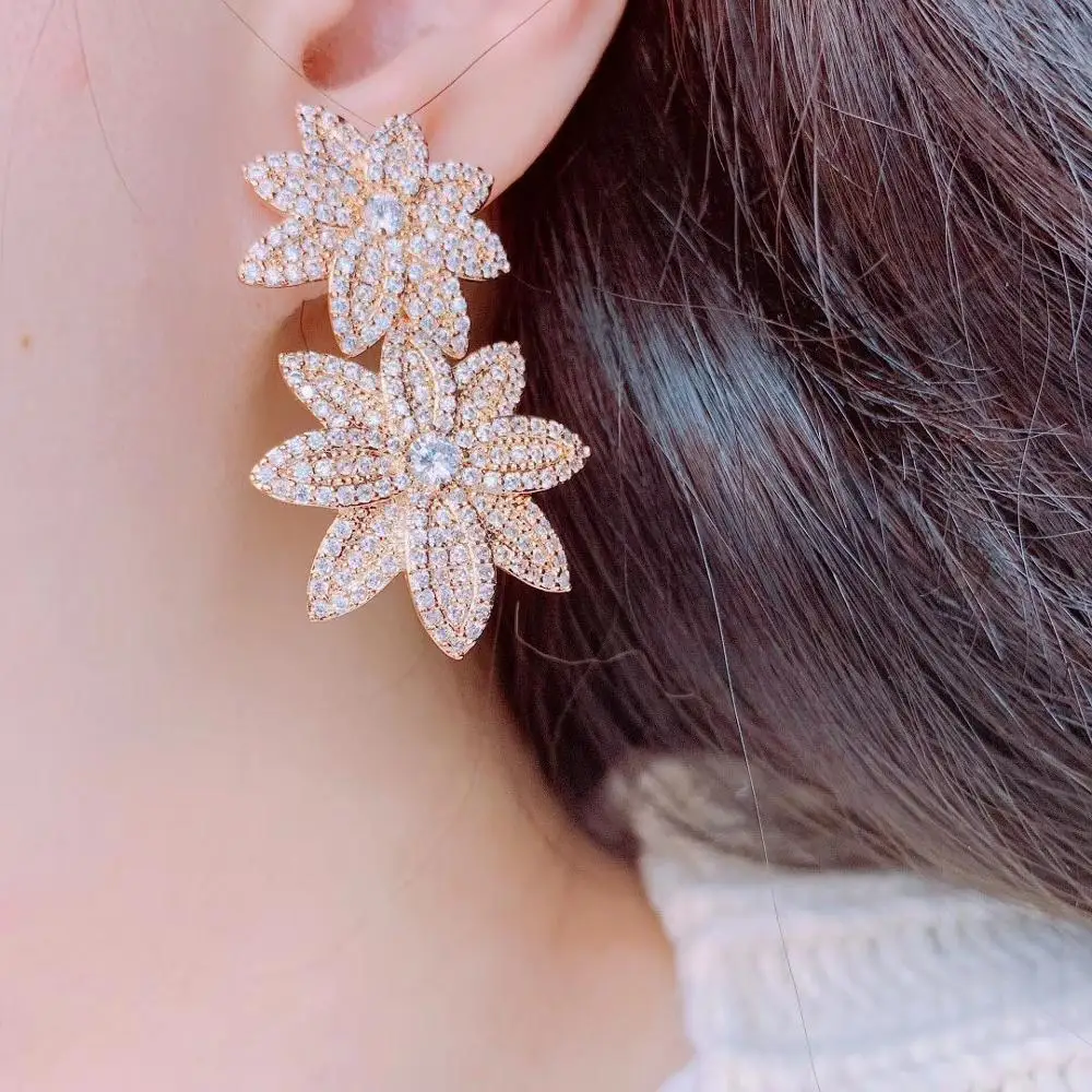 

Sunflower zircon earrings female geometric octagonal Korean three-dimensional snowflake fresh wild ear jewelry earrings earrings