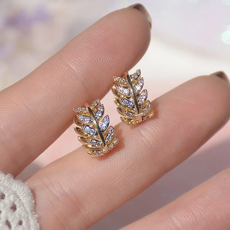 

Женские позолоченные серьги-гвоздики с фианитами, 14 к