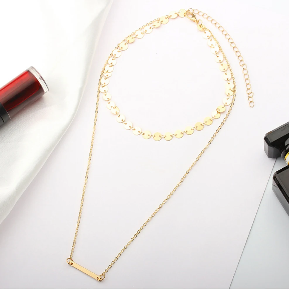 Женское многослойное ожерелье с цепочкой-монеткой