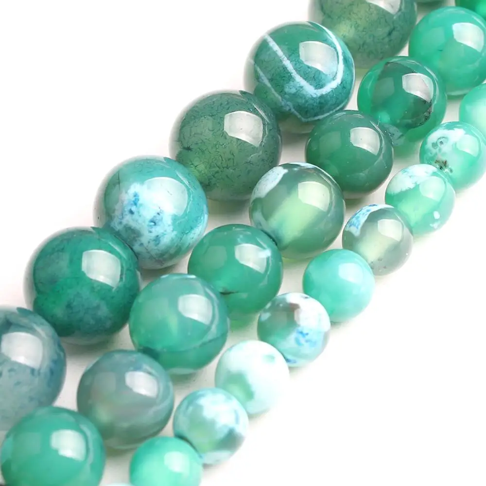 Круглые бусины синего зеленого цветов незакрепленные из натурального камня для