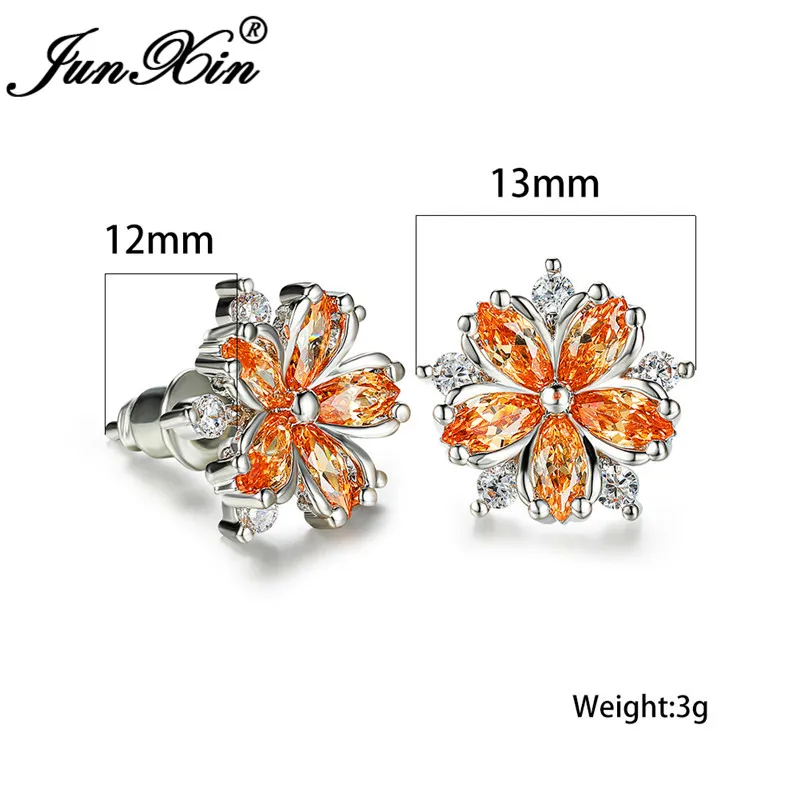 Серьги-гвоздики женские с кристаллами фиолетовые красные в форме снежинки из