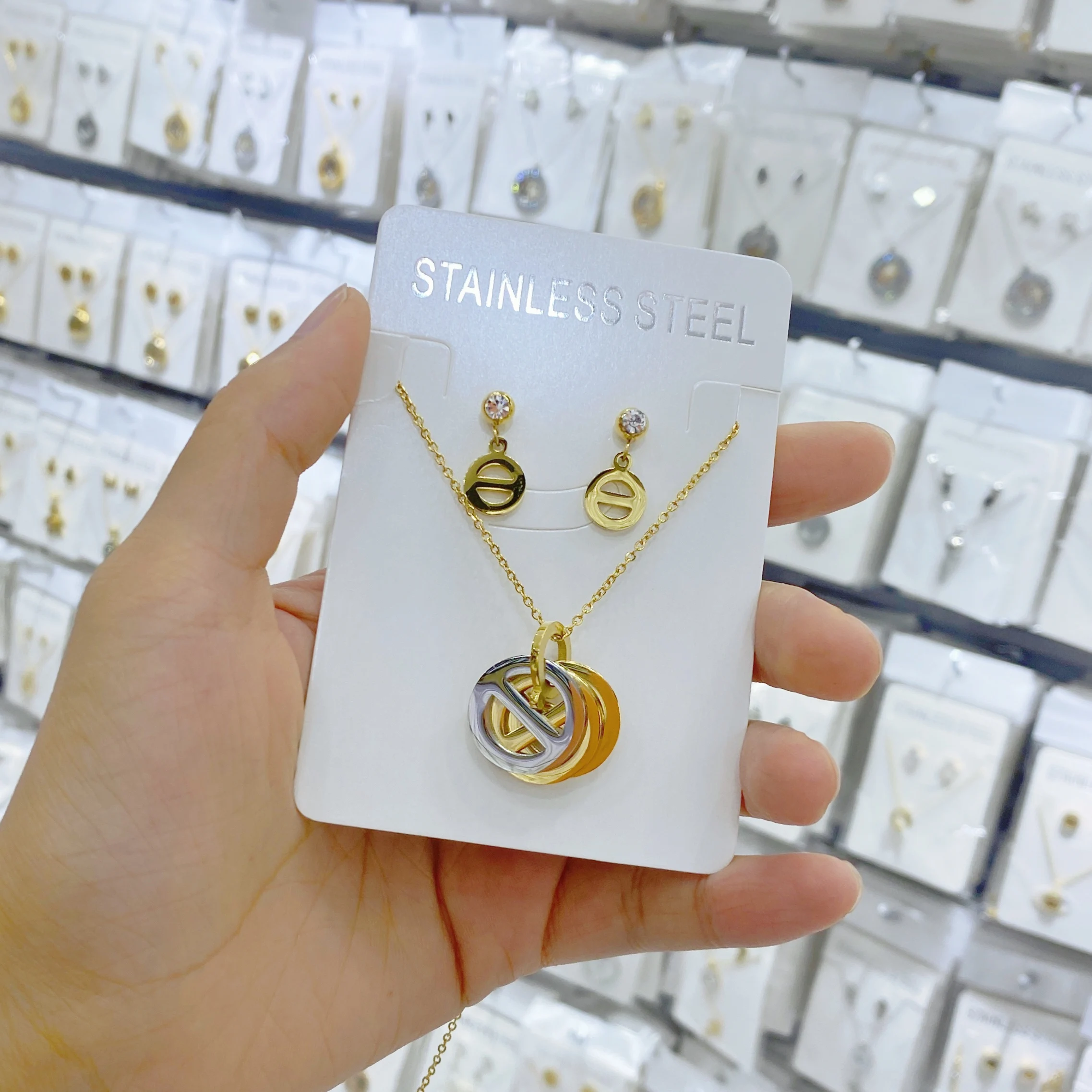 

European and American popular stainless steel pendant necklace earring set for women's New Year gift design