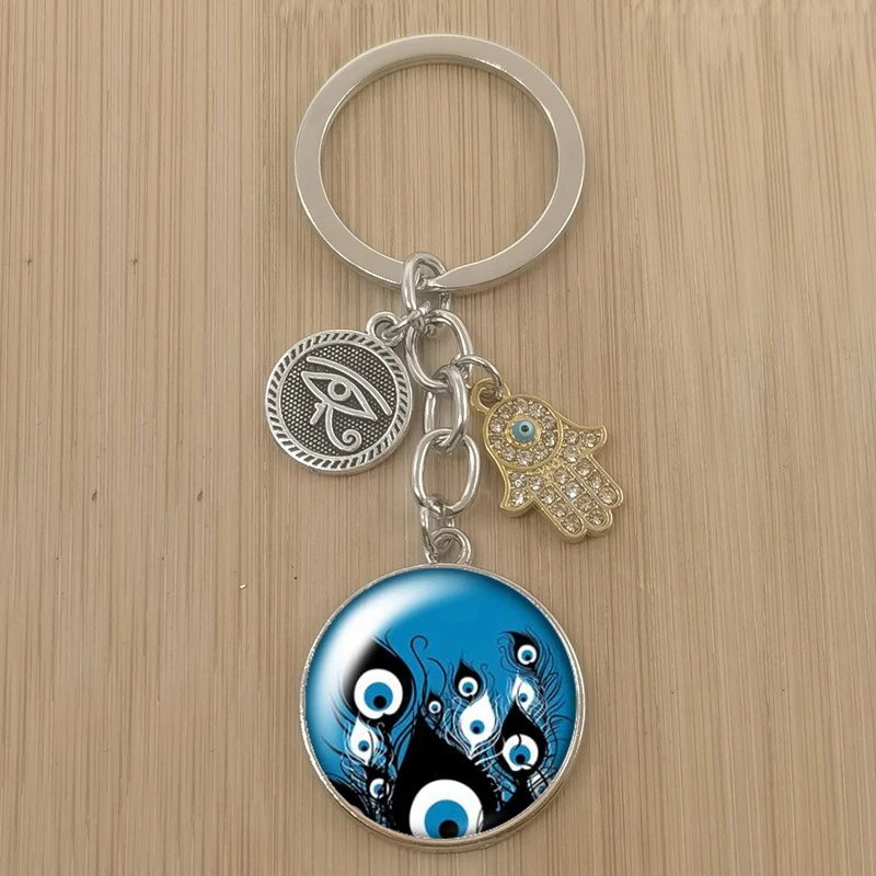 Красивый круглый стеклянный кабошон с изображением синего сглаза для