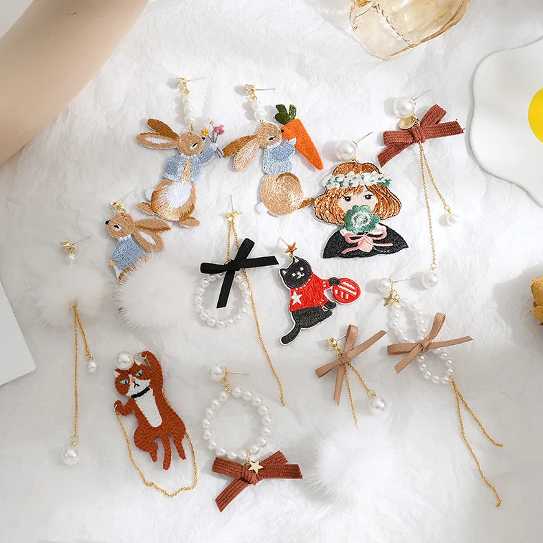 

New hand-made forest series ins earrings retro embroidery cloth cartoon earrings high-quality pearl hair ball earrings