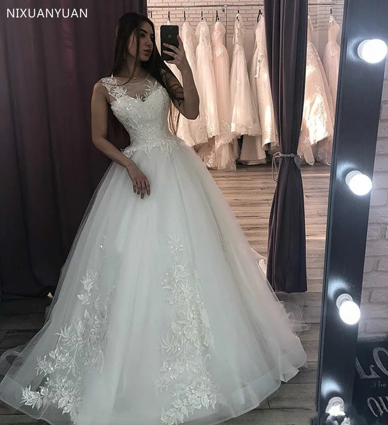 

Tulle Wedding Dress with Lace Appliques Sequins Sheer Jewel Neck Illusion Back Covered with Buttons Vestidos De Novia