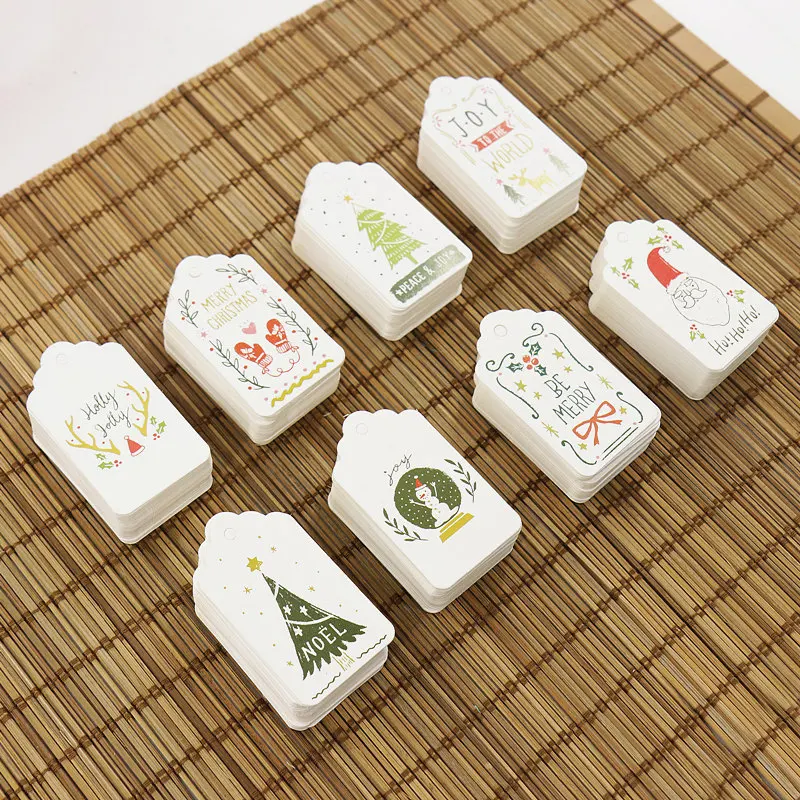 

50PCS Christmas Series Kraft Paper Tags Small Card DIY Crafts Hang Tag With Rope Christmas Party Labels Gift Wrapping Supplies