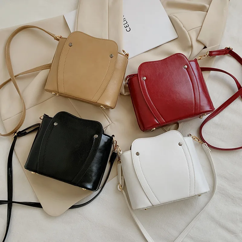 

2021 Women's Bag Wind Shoulder Bag Texture Solid Color Slant Zipper Mobile Phone Shell Bag
