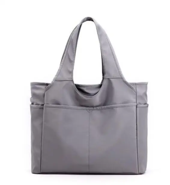 

New women's large-capacity simple and lightweight anti-shoulder portable travel cloth bag