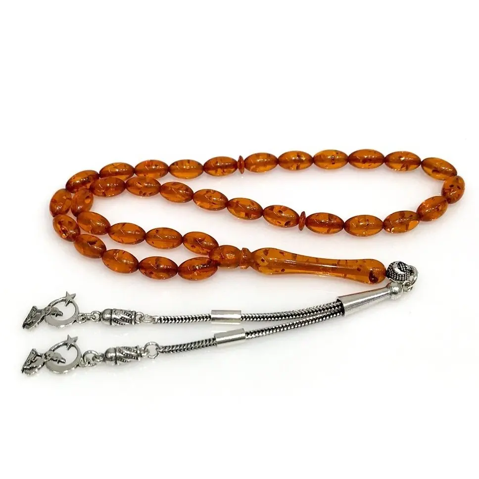 

Amber squeezing Gray Wolf Tassel Silver Prayer Beads