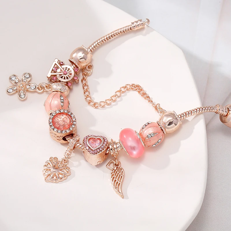 Женские браслеты подвески с перьями и сердечками из розового золота