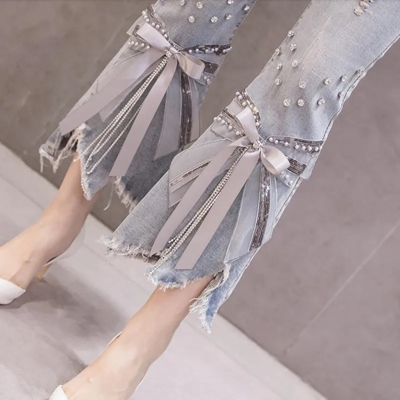 

2021 new high waist irregular Beaded bow jeans women's horn split jeans summer