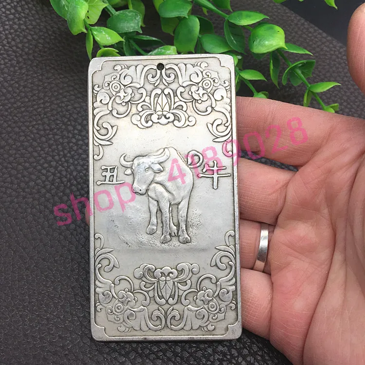 

Pure white copper, twelve zodiac cattle number plate on a vehicle