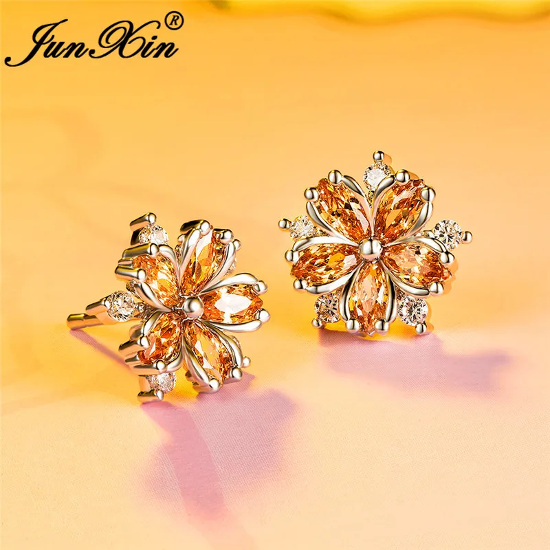 Серьги-гвоздики женские с кристаллами фиолетовые красные в форме снежинки из