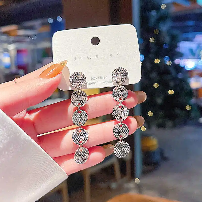 

S925 silver needle Korean version new wafer super flash long earrings women's fashion simple personality creative Earrings Ear