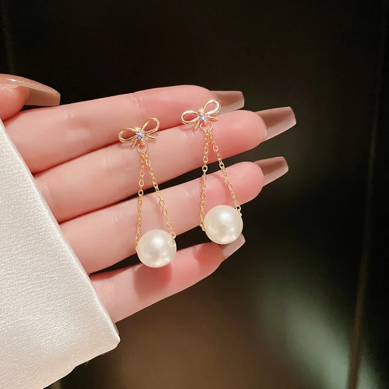 

Korean fashion simulation pearl 2021 new net red explosion bow simple and sweet temperament earring jewelry female