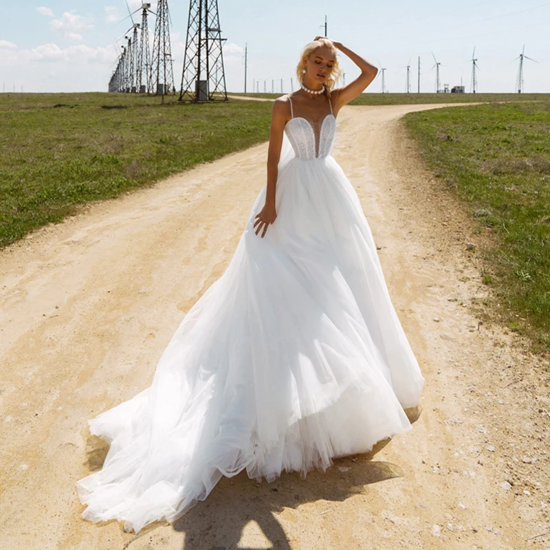 

Sexy Deep Sweetheart Neckline Spaghetti Straps Heavy Crystals White Wedding Dress with Pearls Court Train Puffy Bridal Dress