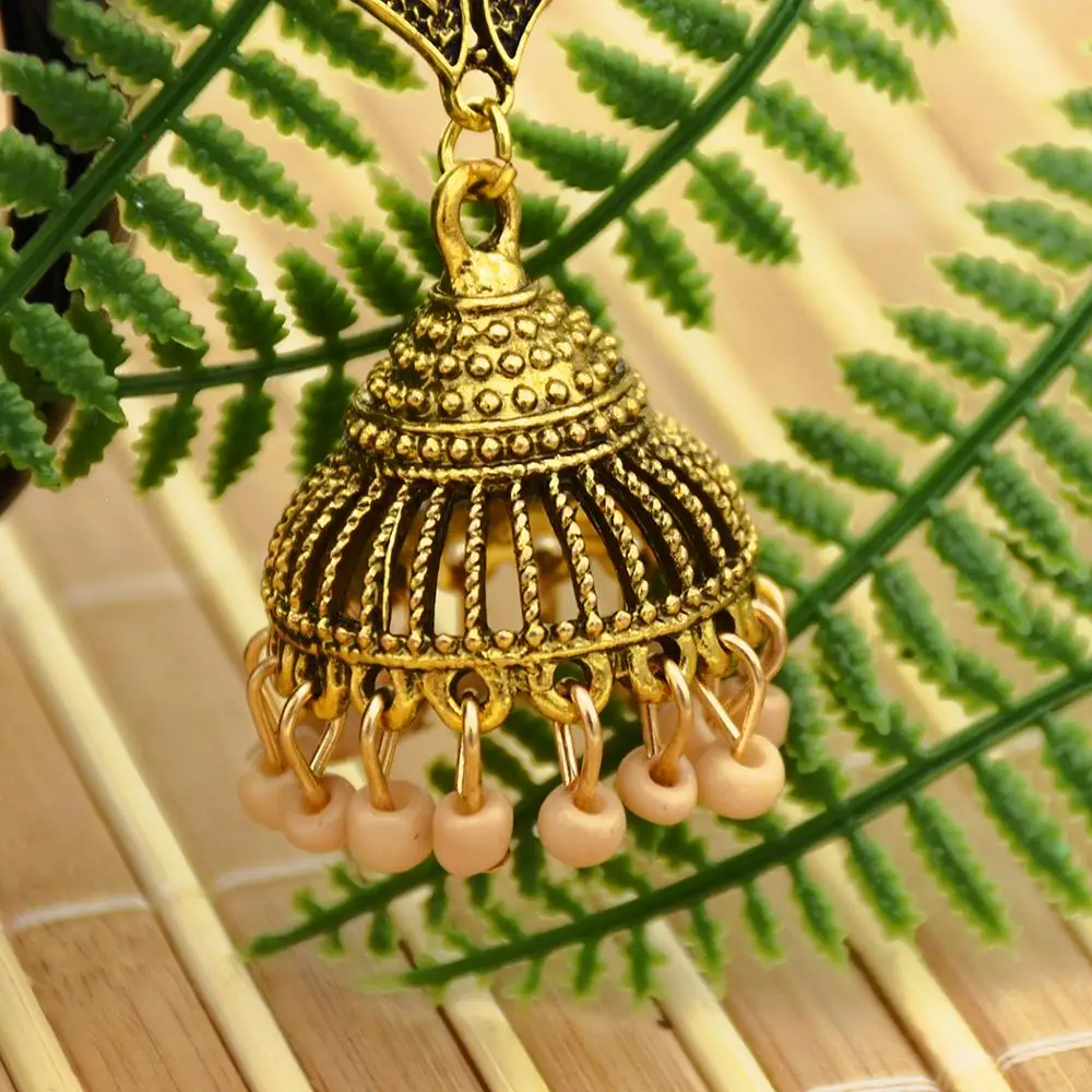 

The New Rice Beads Pendant Earrings Gold Alloy Pattern Earrings Retro Ethnic Style European and American Exaggerated Jewelry.