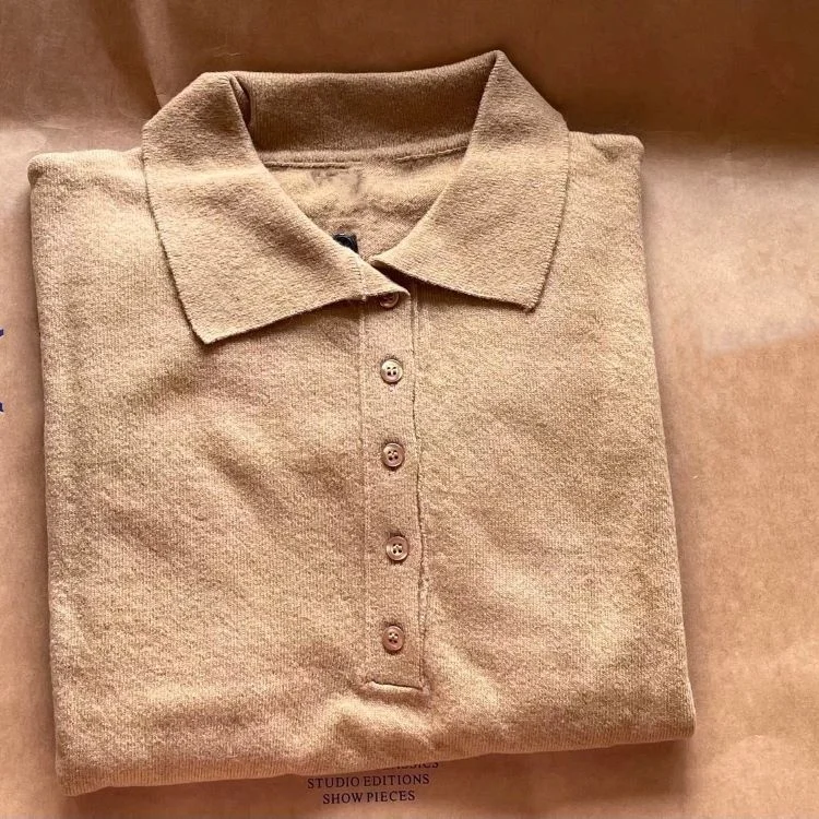 

DS Nordic minority loose casual wool poio neck knitted medium sleeve top Lapel short sleeve sweater women