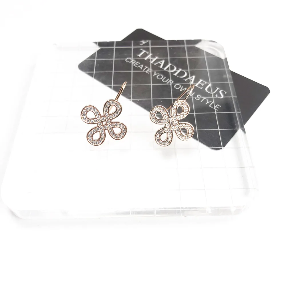 Серьги подвески в виде любовного узла цвета розового золота романтические