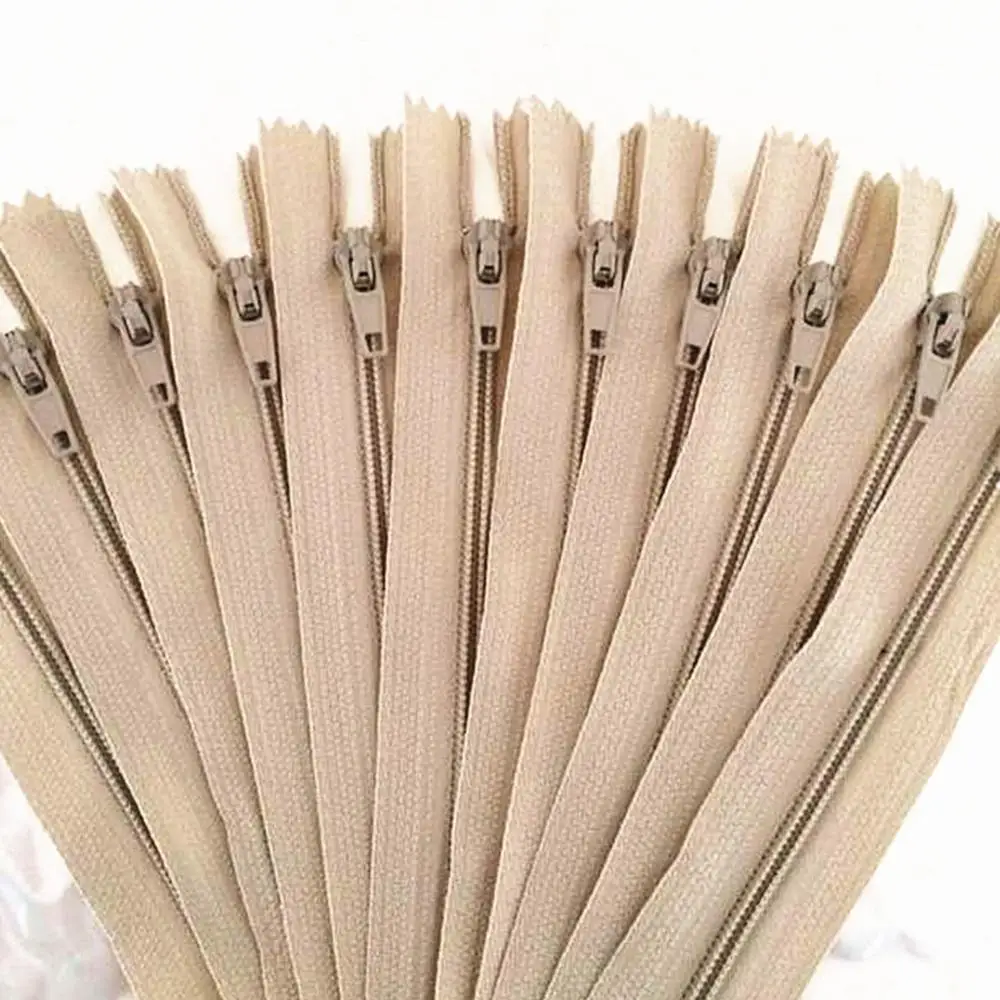 

10 pieces. 55cm (22inch) Beige nylon coil, zipper, tailor, crafter and fgdqrs
