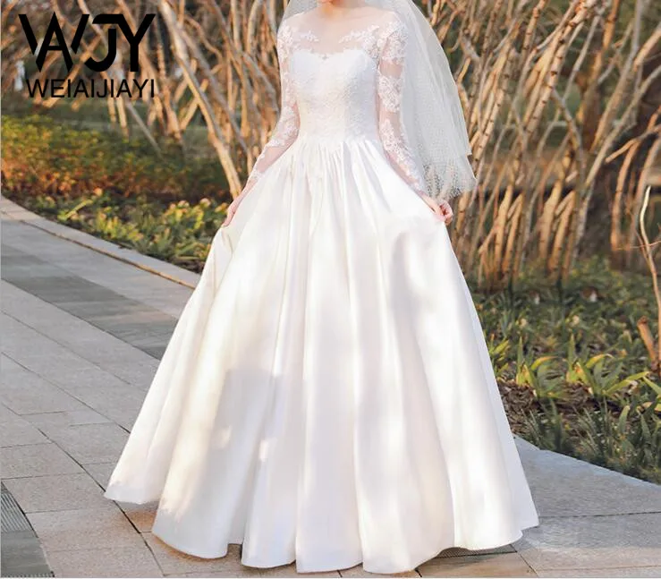 Фото Простой стиль отвесное декольте белые свадебные платья с длинным рукавом