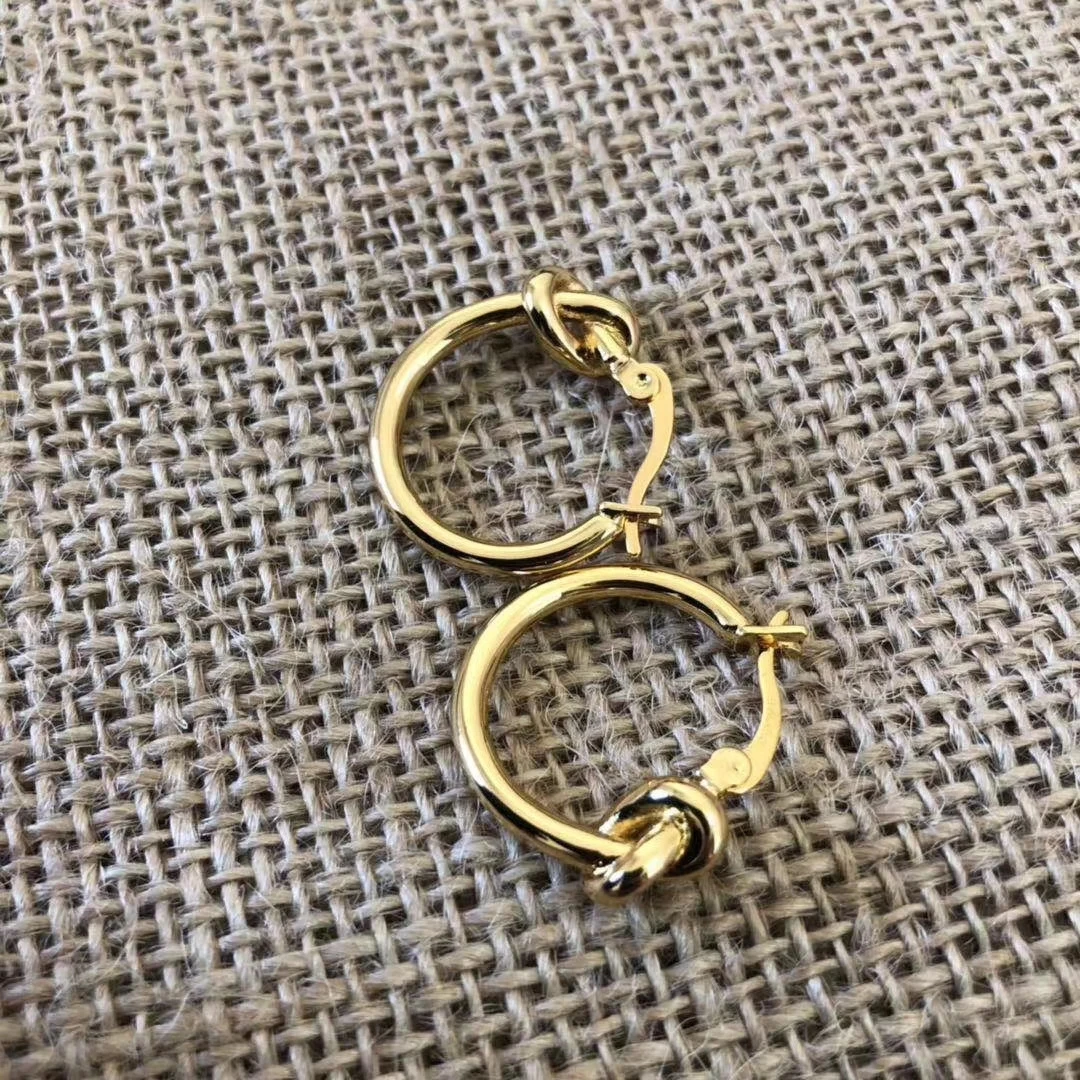 

One bangle both with gold and silver color, one pair of knot gold earring,one letter I bracelet