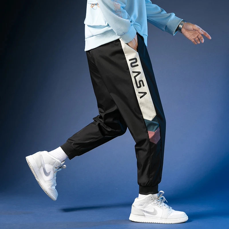 

2021 New Casual Pants Men's Colorful Print Reflective Chameleon Reflective Pants Man Matte trousers