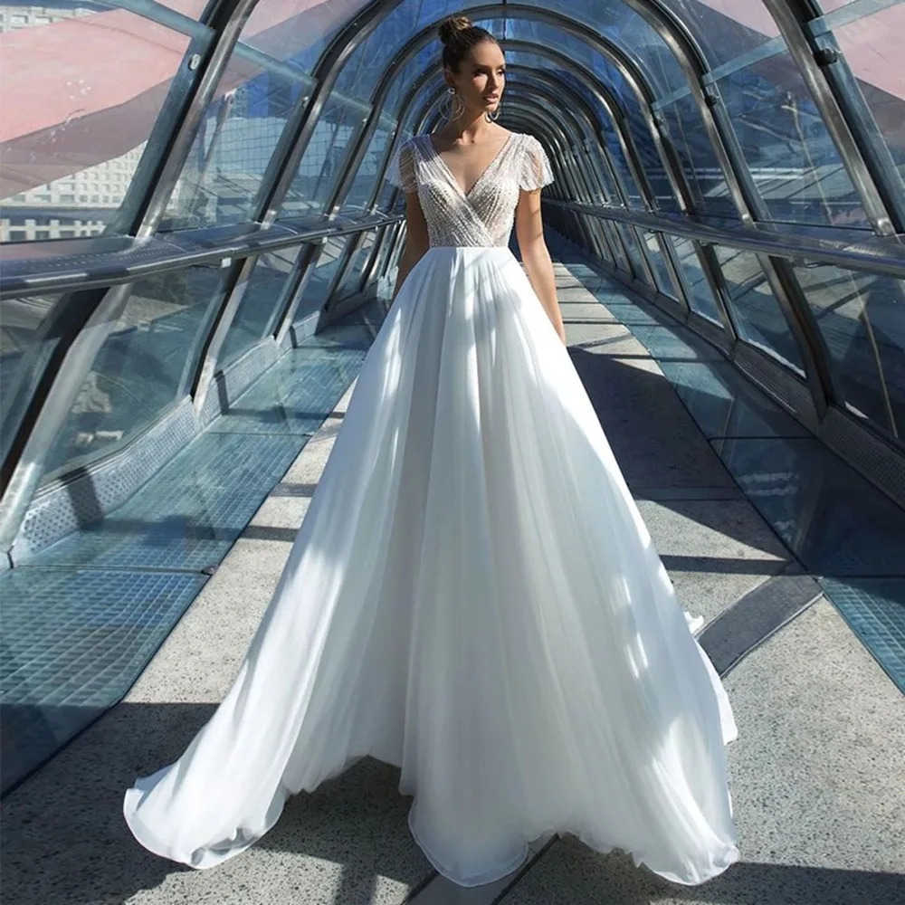 

2021 V-Neck Wedding Dress A-Line Cap Sleeve Sequined Beading Sweep Train Bridal Gown For Women Chiffon Backless Charming Sheer