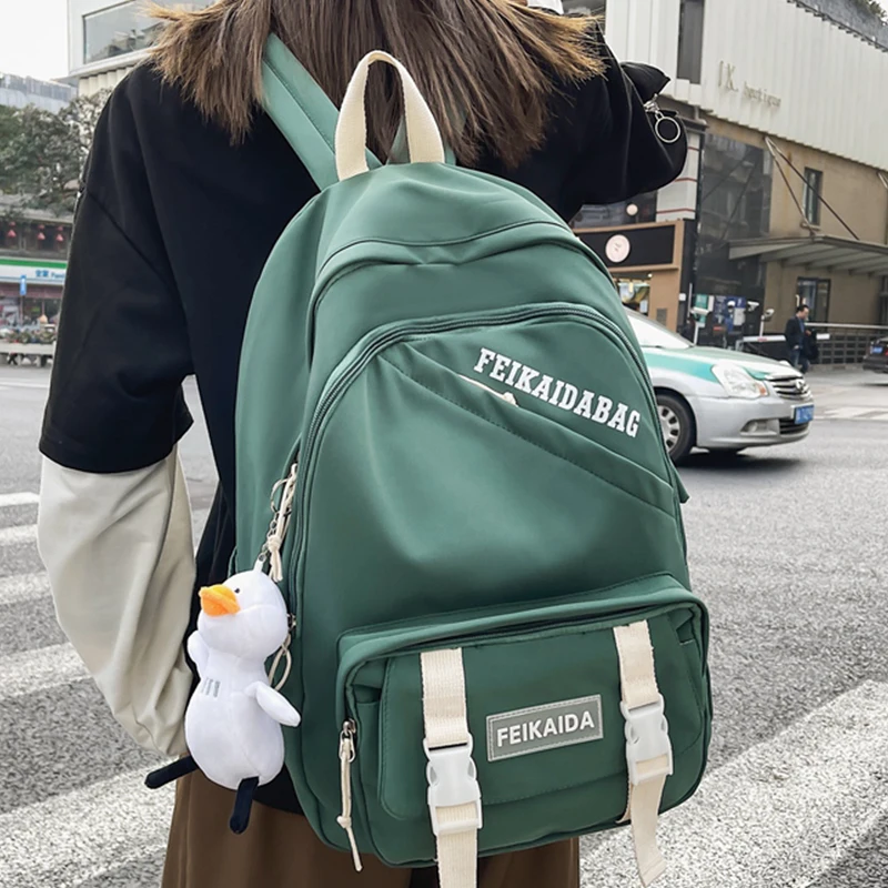 

Новый однотонный вместительный женский школьный рюкзак EST, водонепроницаемый нейлоновый Женский Повседневный дорожный кавайный школьный ...