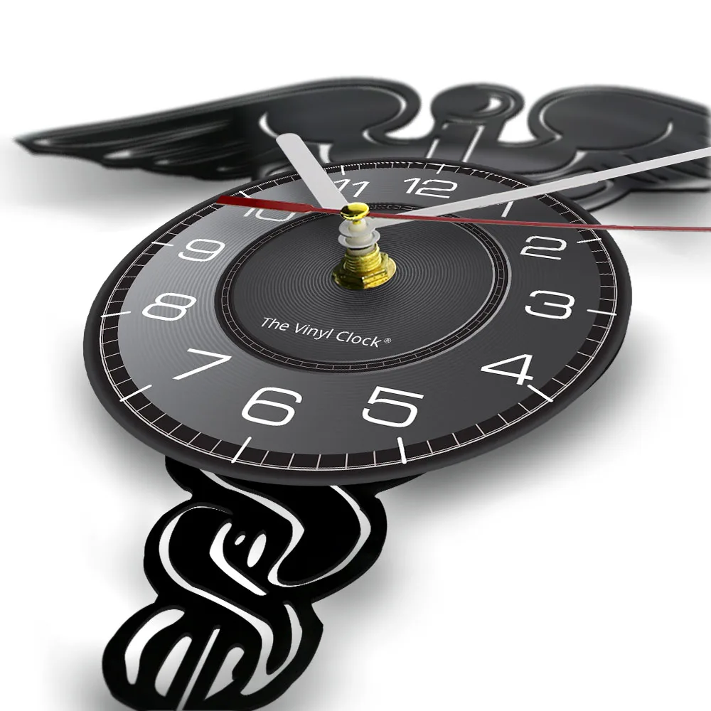 Часы настенные виниловые с изображением крыльев змеи и пластинки в медицинской