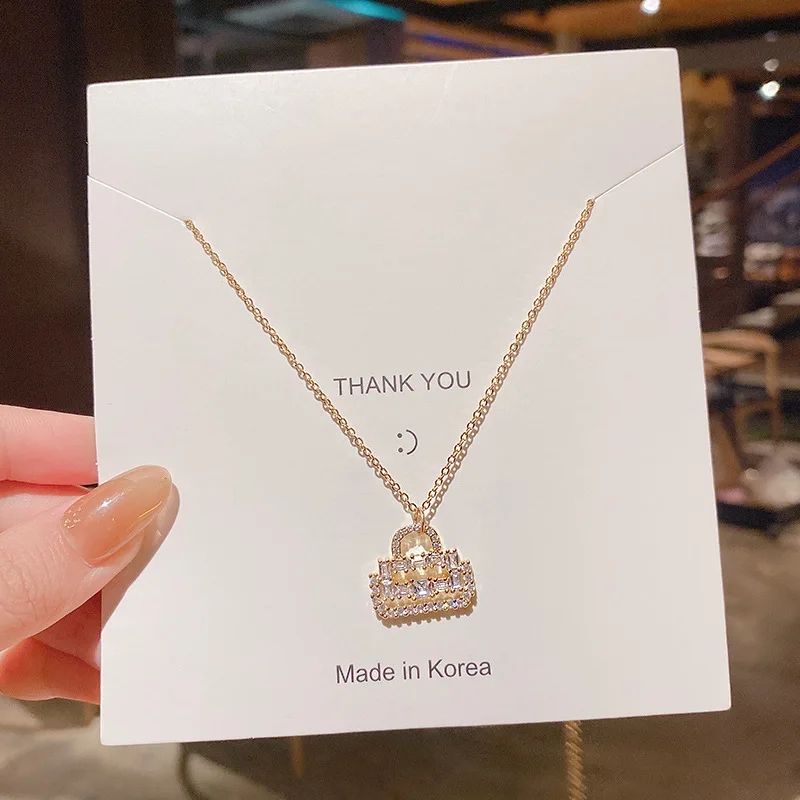 

Korean fashion personality full diamond small bag pendant titanium steel necklace female temperament simple clavicle chain