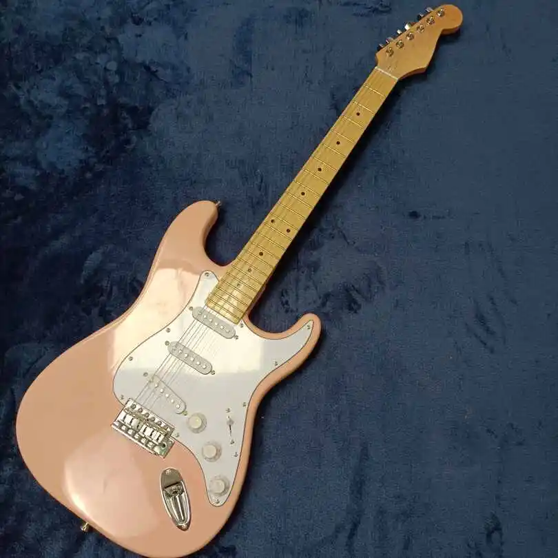 

High-quality 6-string electric guitar, basswood body, light pink bright paint, support customization, free delivery.