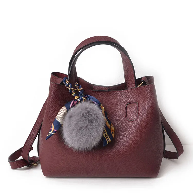 

Large-capacity mother bag girl bag 2020 new fur ball bag one shoulder oblique across the handbag