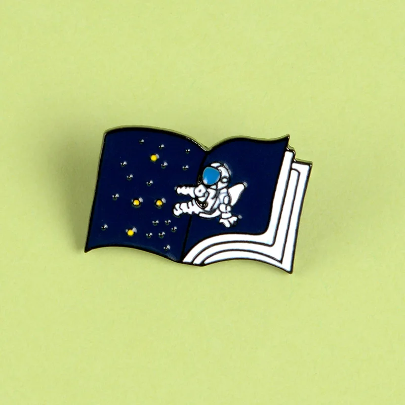 

Astronaut Enamel Pin Custom Starry Sky Book Brooches for Bag Clothes Lapel Pin Universe Badge Space Jewelry Gift Kids Friends