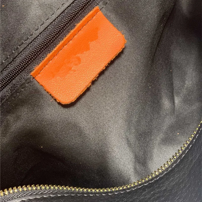 

Star same style leather knitting large capacity hand-held Tote mother and son bag single shoulder cowhide underarm shopping bag