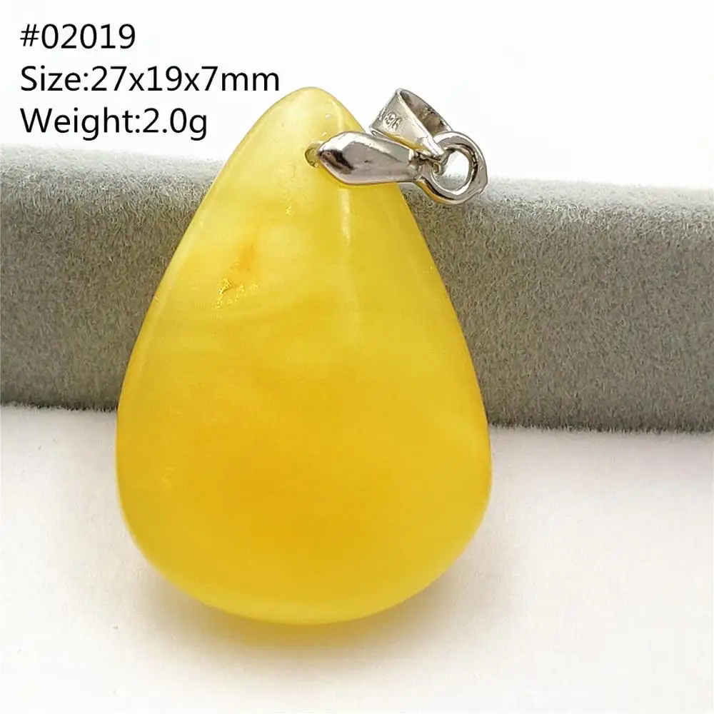 Подвеска из натурального янтаря с желтым драгоценным камнем 27x19x7 мм в виде капли
