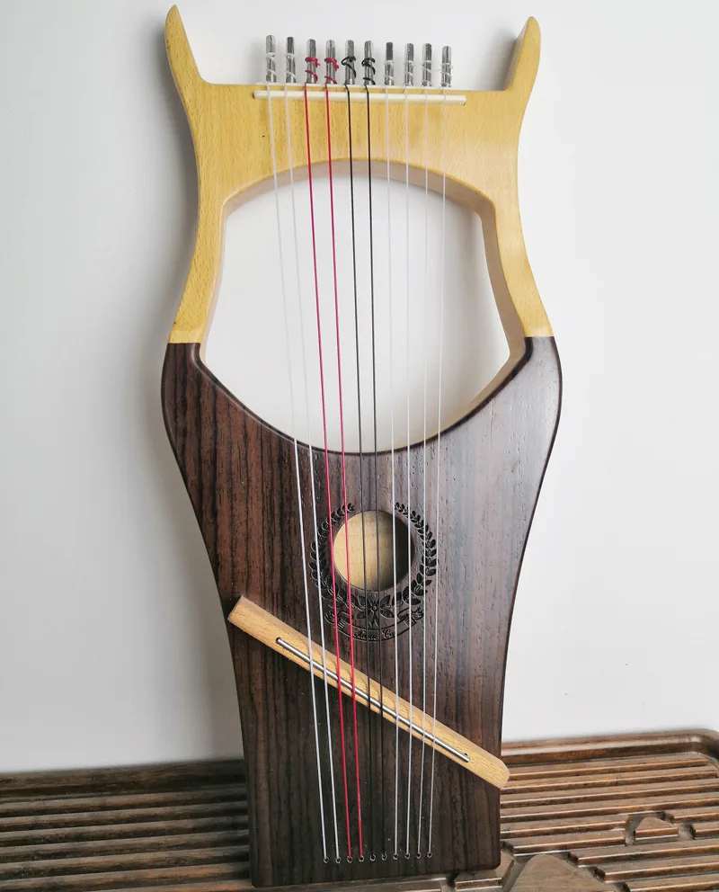 Kalimba piano solid wood veneer Lai Ya Qin thumb harp lyre ten string portable lyre. |