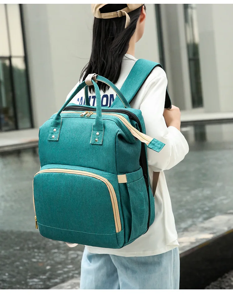 

New portable folding crib mommy bag portable shoulder Diaper Bag multifunctional large capacity mother and baby bag