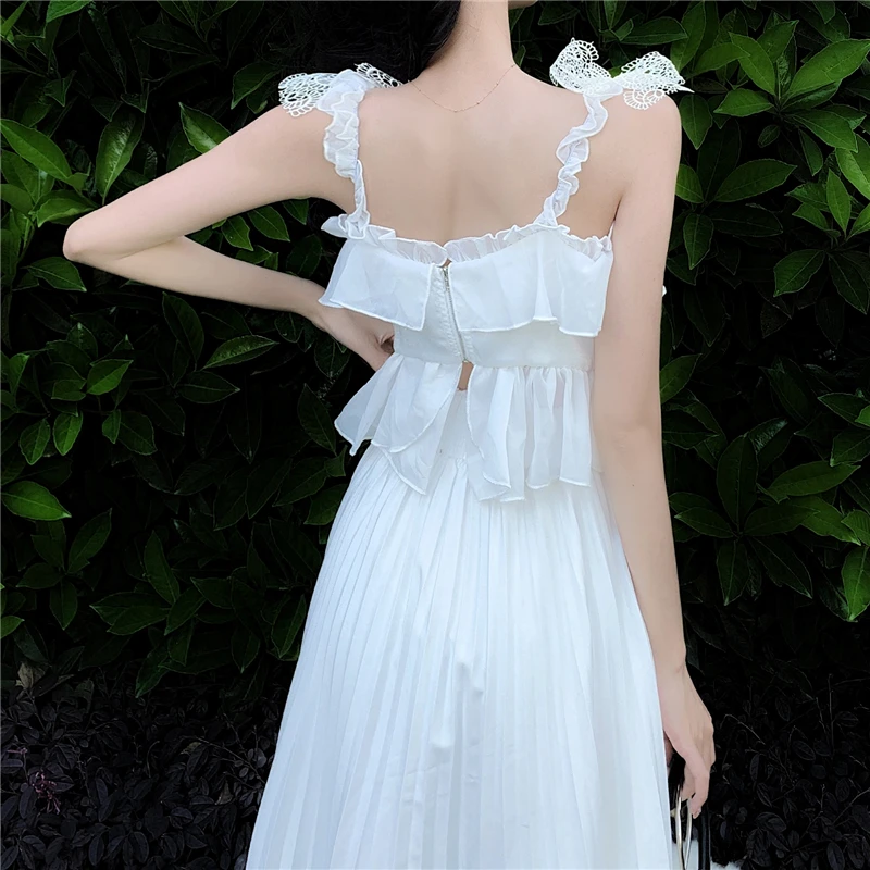 

Qiukichonson Spring Summer Fairy Big Swing White Pleated Skirt Women Cute High Waist A-Line Asymmetrical Ruffle Midi Long Skirts