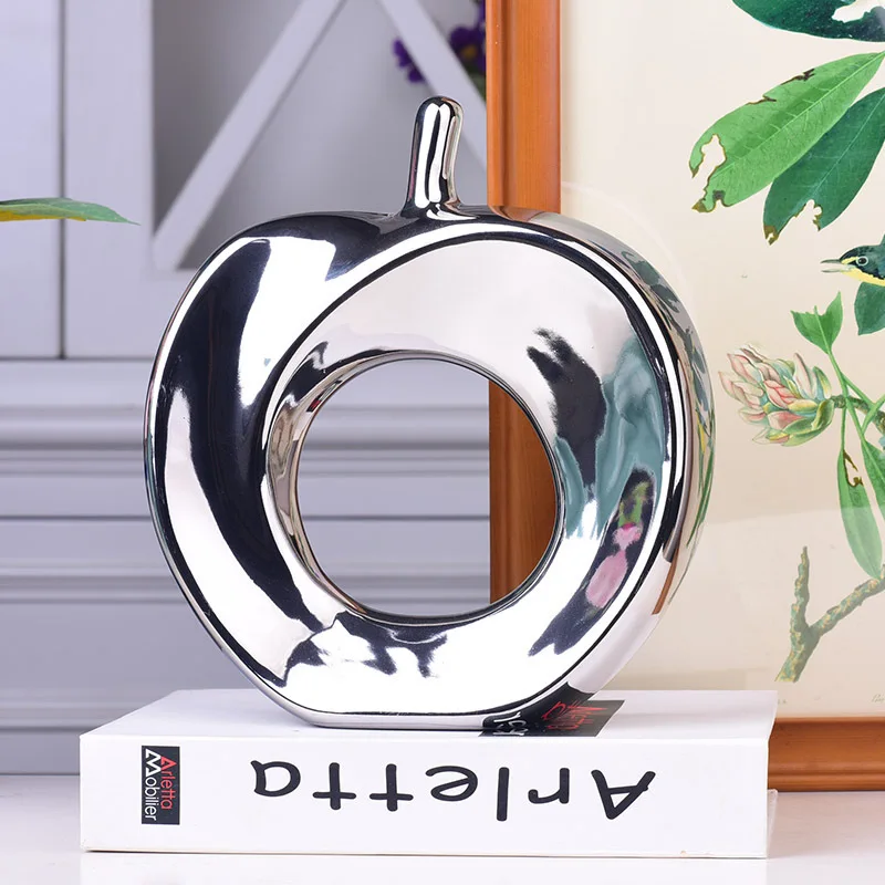 В абстрактном керамическая с гальваническим покрытием яблоко рукоделия