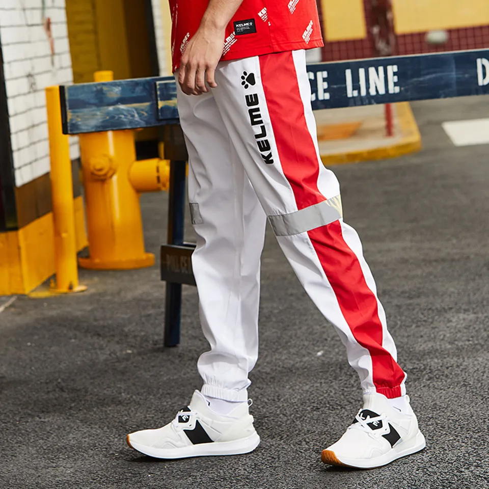 KELME Японская уличная одежда мужские брюки с полосками сбоку светоотражающие