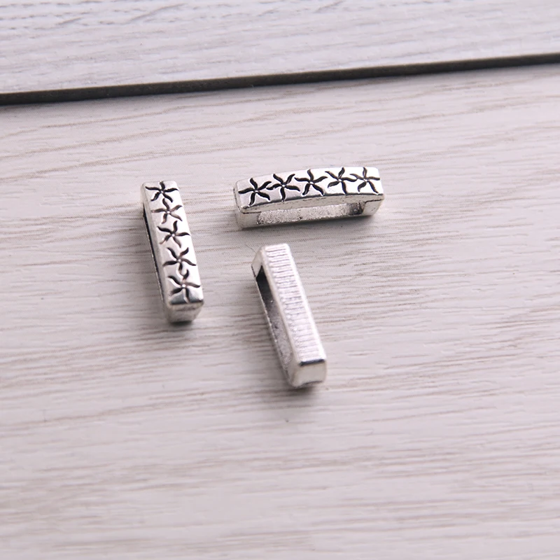 

SWEET BELL 60Pcs Two Color Slider Spacer Beads Carved Flower Hole 10*2.5mm Leather DIY Bracelet Making Accessorie