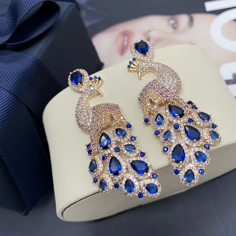 

Blue peacock earrings earrings female long style temperament ethnic style color diamond peacock open screen earrings stage banqu