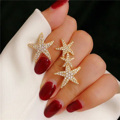 

Earring Women's S925 Silver Needle Light Luxury Tropical Style Micro-Inlaid Diamond Asymmetric Starfish Temperament Earrings.