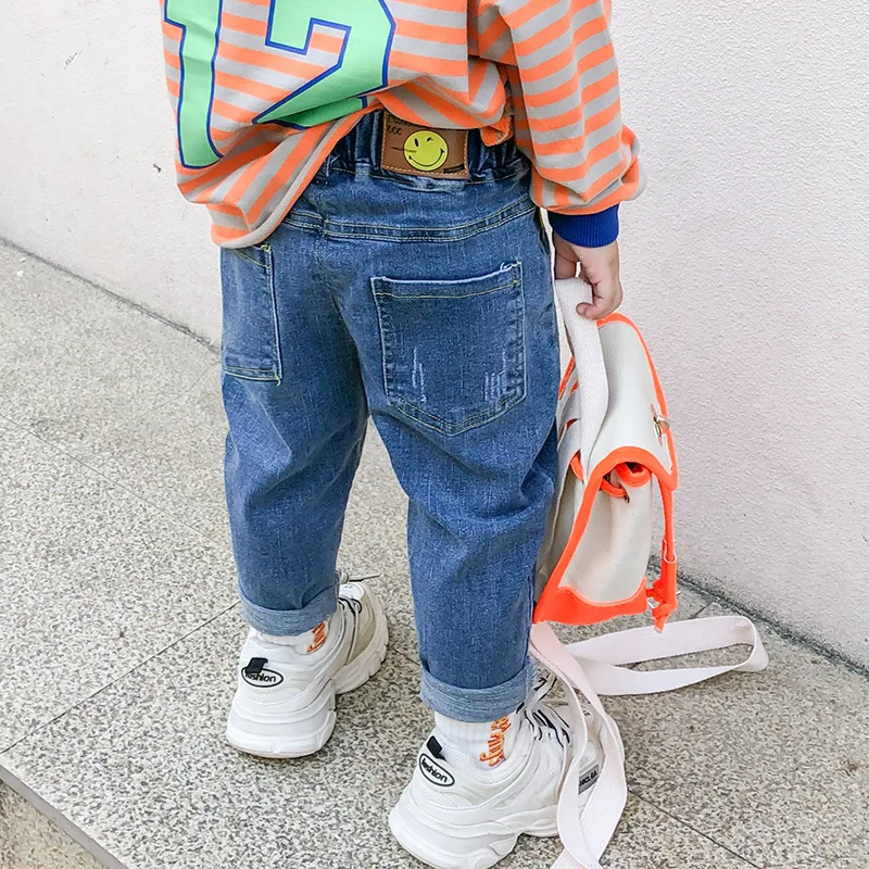 

Autumn Kids Trendy Pants Children Jeans Little Boys Trousers With Smiling Face Korean Teenagers Clothing Toddler Bell Bottoms