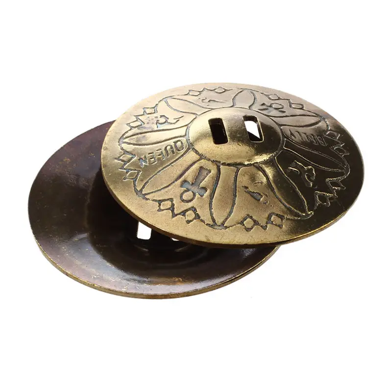 

for the belly dance, pair of finger cymbals, in copper, gilded