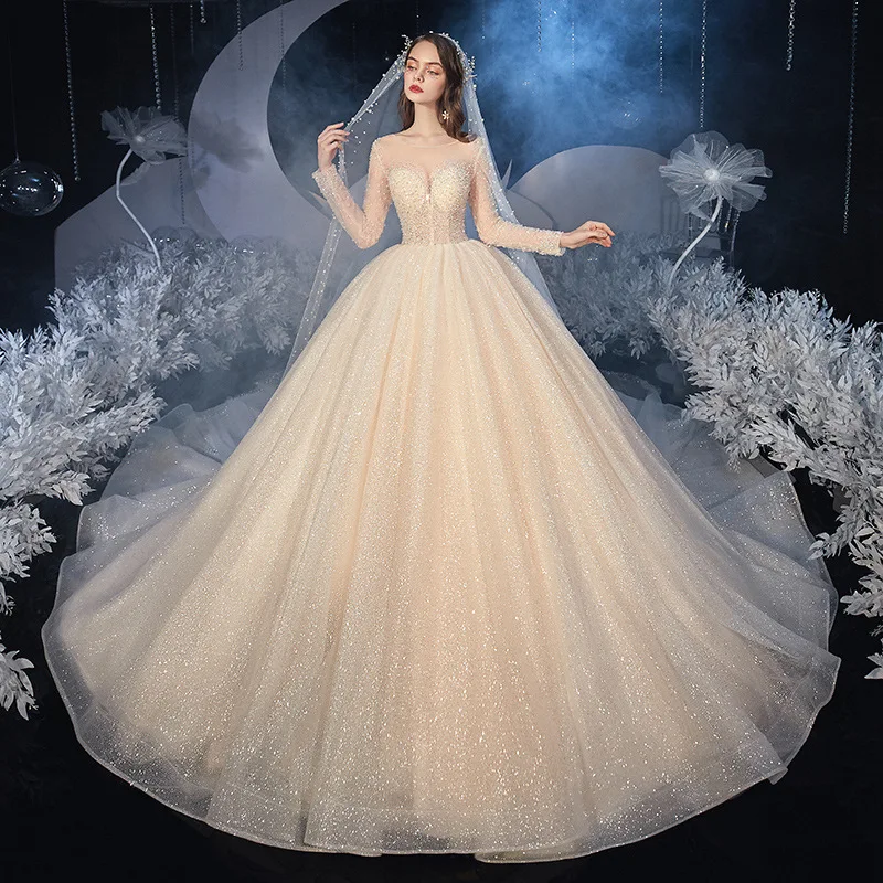 

Luxury Princess Wedding Dress Long Sleeves O-Neck Beading Sequins Shiny Champagne Chapel Train Saudi Sexy Illusion Bridal Gowns